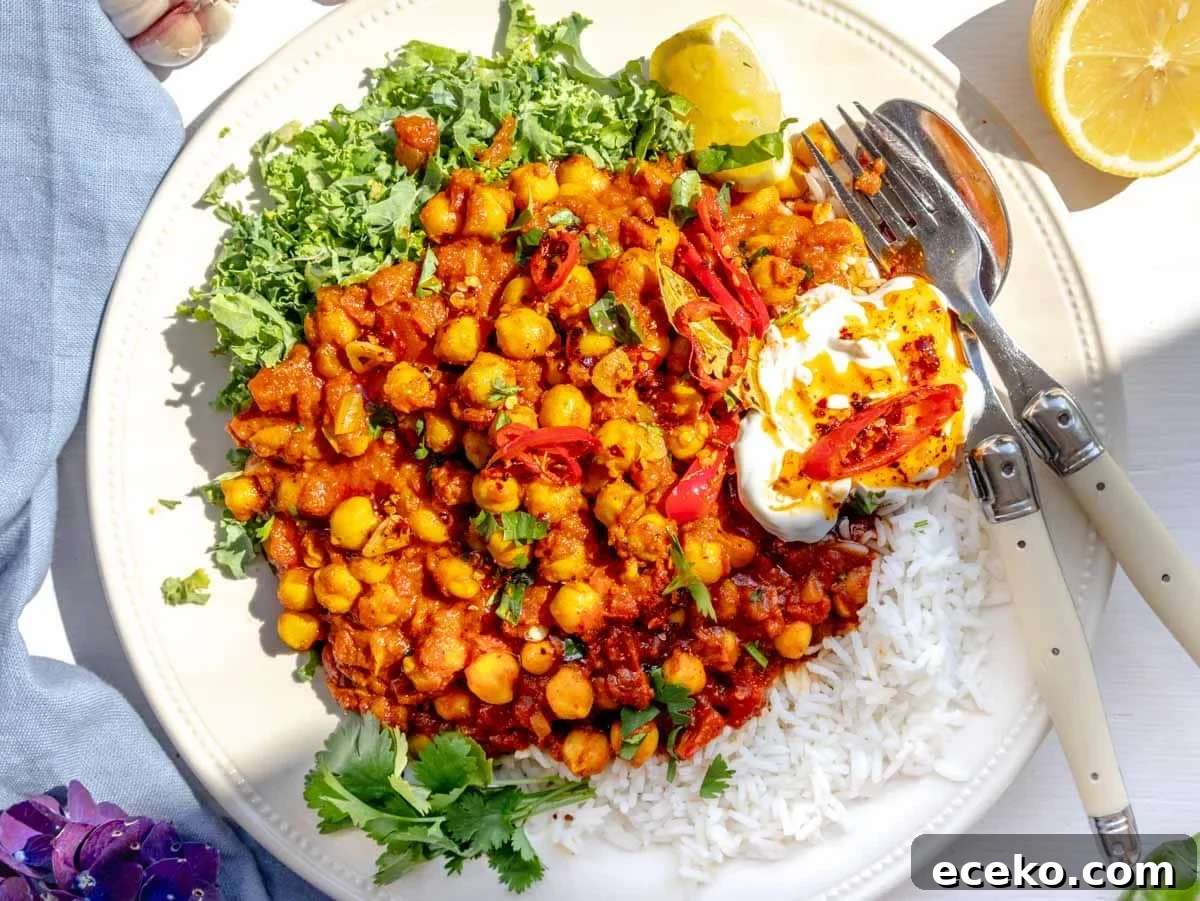 How to Make Tadka: Quick Guide to Tempering Indian Spices 7 Chana masala served on a plate with kale, yogurt, and chili oil