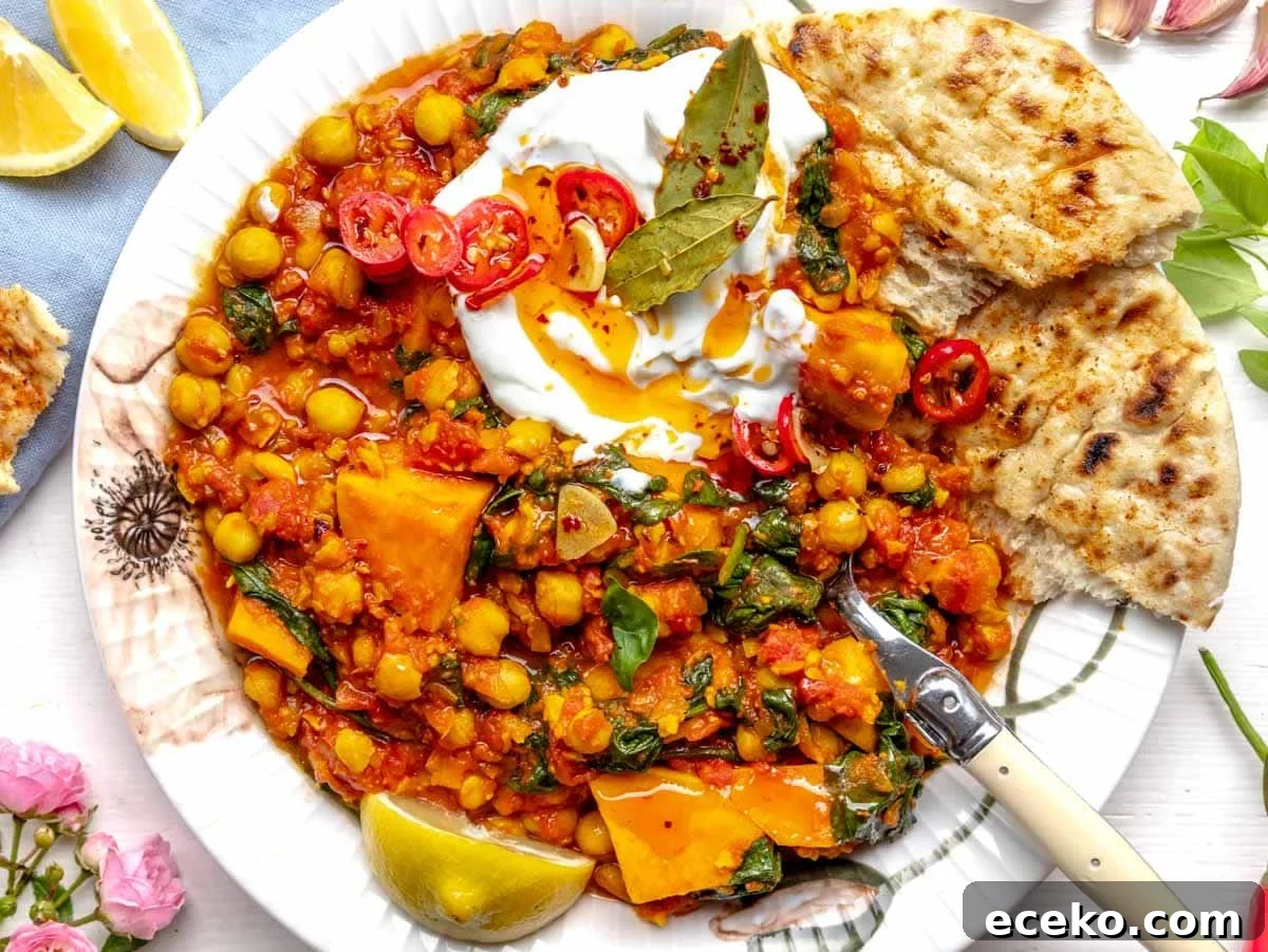How to Make Tadka: Quick Guide to Tempering Indian Spices 9 Chickpea stew with yogurt and chili oil on a plate with flowers