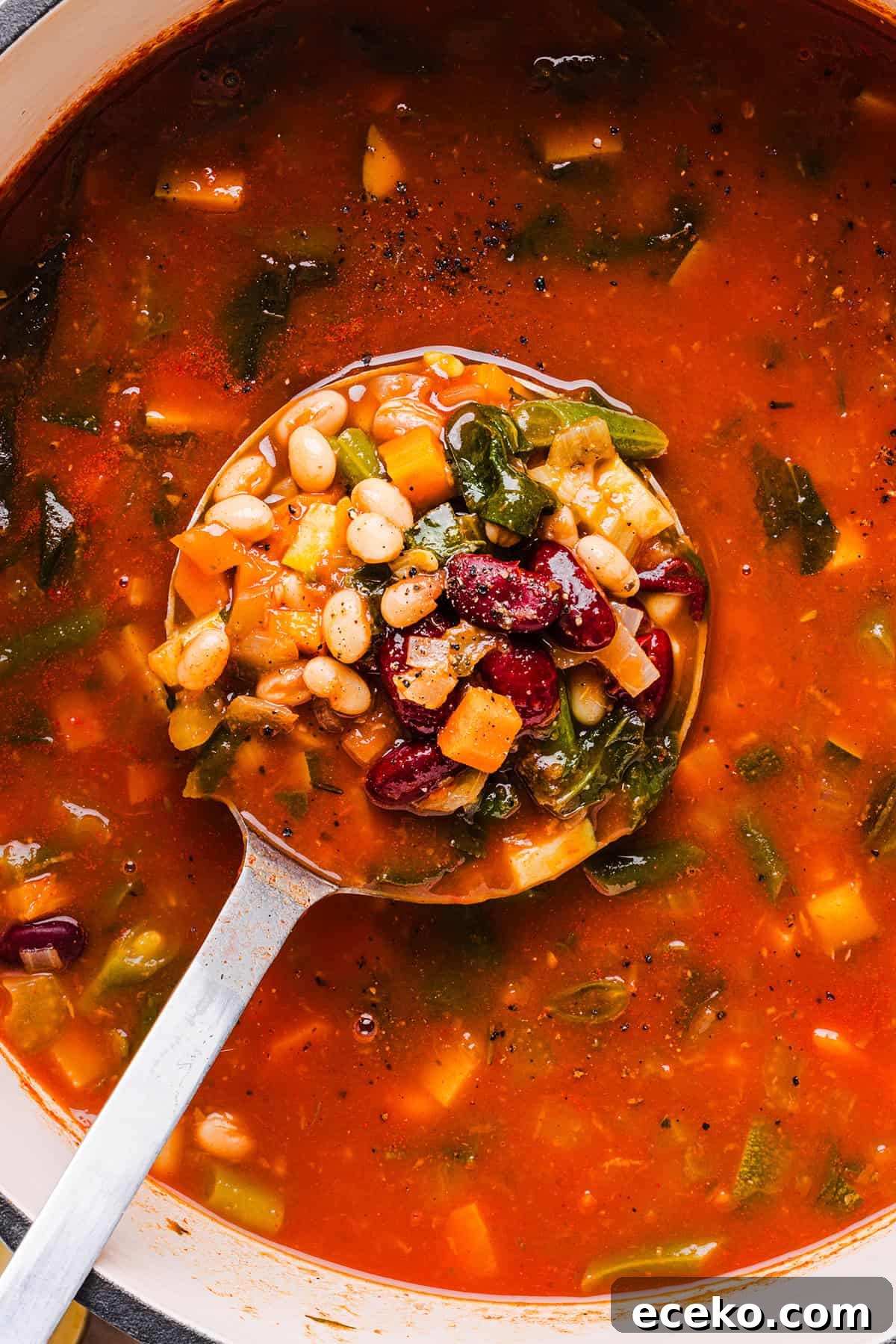 Easy and delicious Olive Garden Minestrone Soup loaded with fresh veggies, leafy greens and simmered in the most flavorful broth! Easily made in one pot for a cozy weeknight dinner the whole family will love!