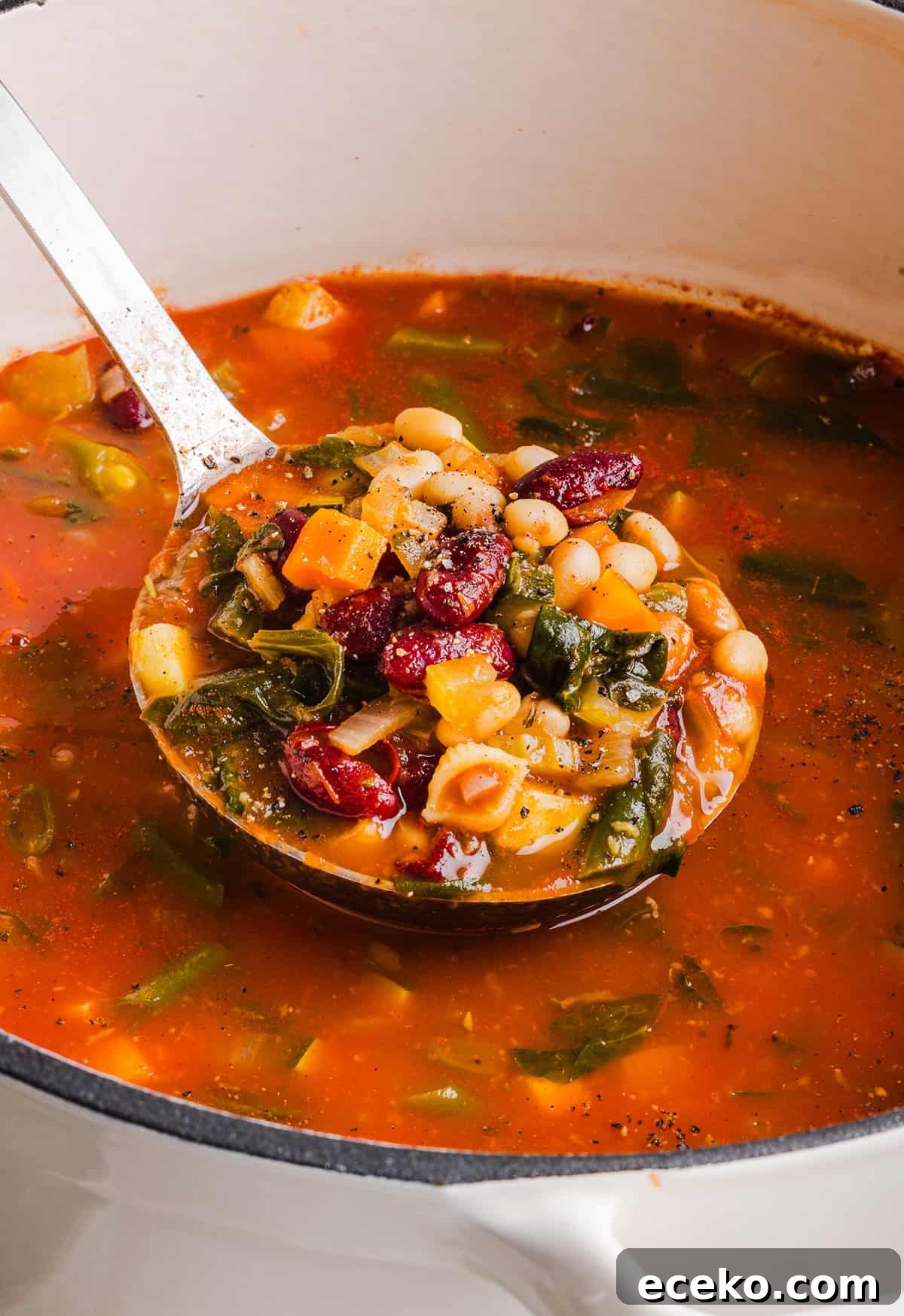 Easy and delicious Olive Garden Minestrone Soup loaded with fresh veggies, leafy greens and simmered in the most flavorful broth! Easily made in one pot for a cozy weeknight dinner the whole family will love!
