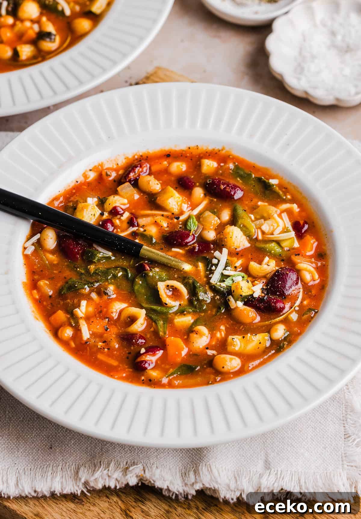 Easy and delicious Olive Garden Minestrone Soup loaded with fresh veggies, leafy greens and simmered in the most flavorful broth! Easily made in one pot for a cozy weeknight dinner the whole family will love!