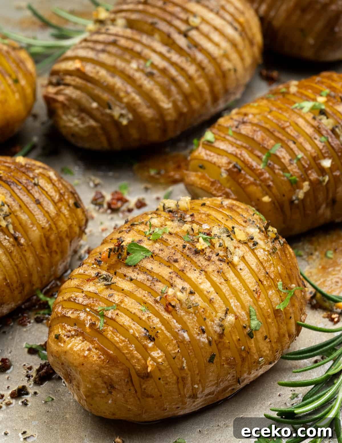 Hasselback Potatoes are a fun way to serve baked potatoes. Potatoes are sliced thin, flavoured with garlic rosemary butter, then baked until they are crispy on the outside and cooked perfectly on the inside. 
