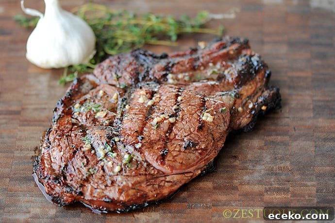 rib-eye steak on wooden board