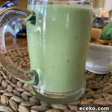 Smoothie in a large glass cup.