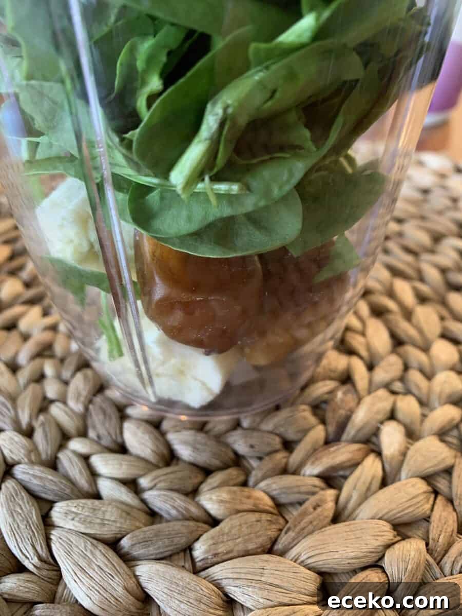 Spinach, dates and banana in a blender cup.