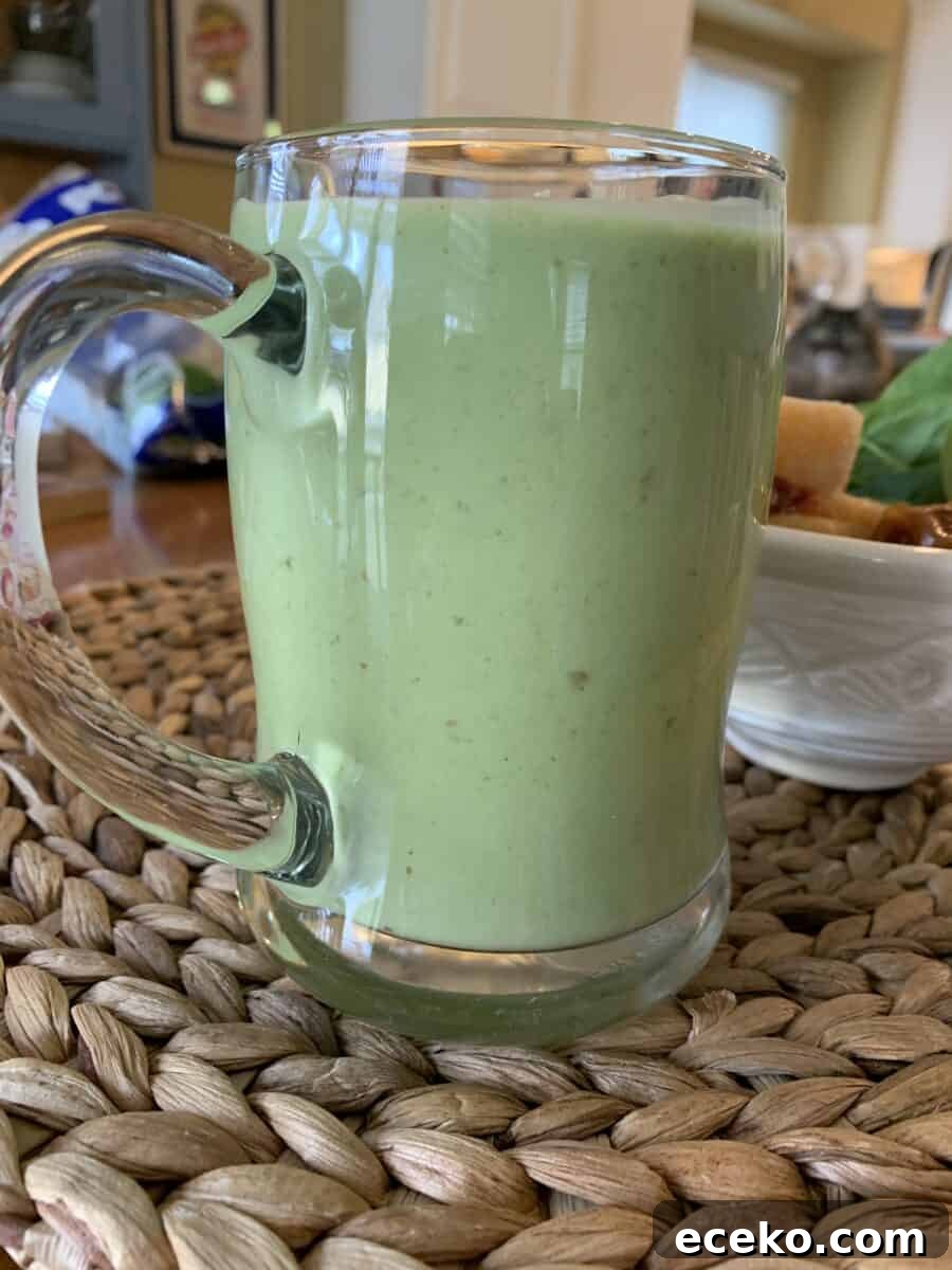 Smoothie in a large glass cup.