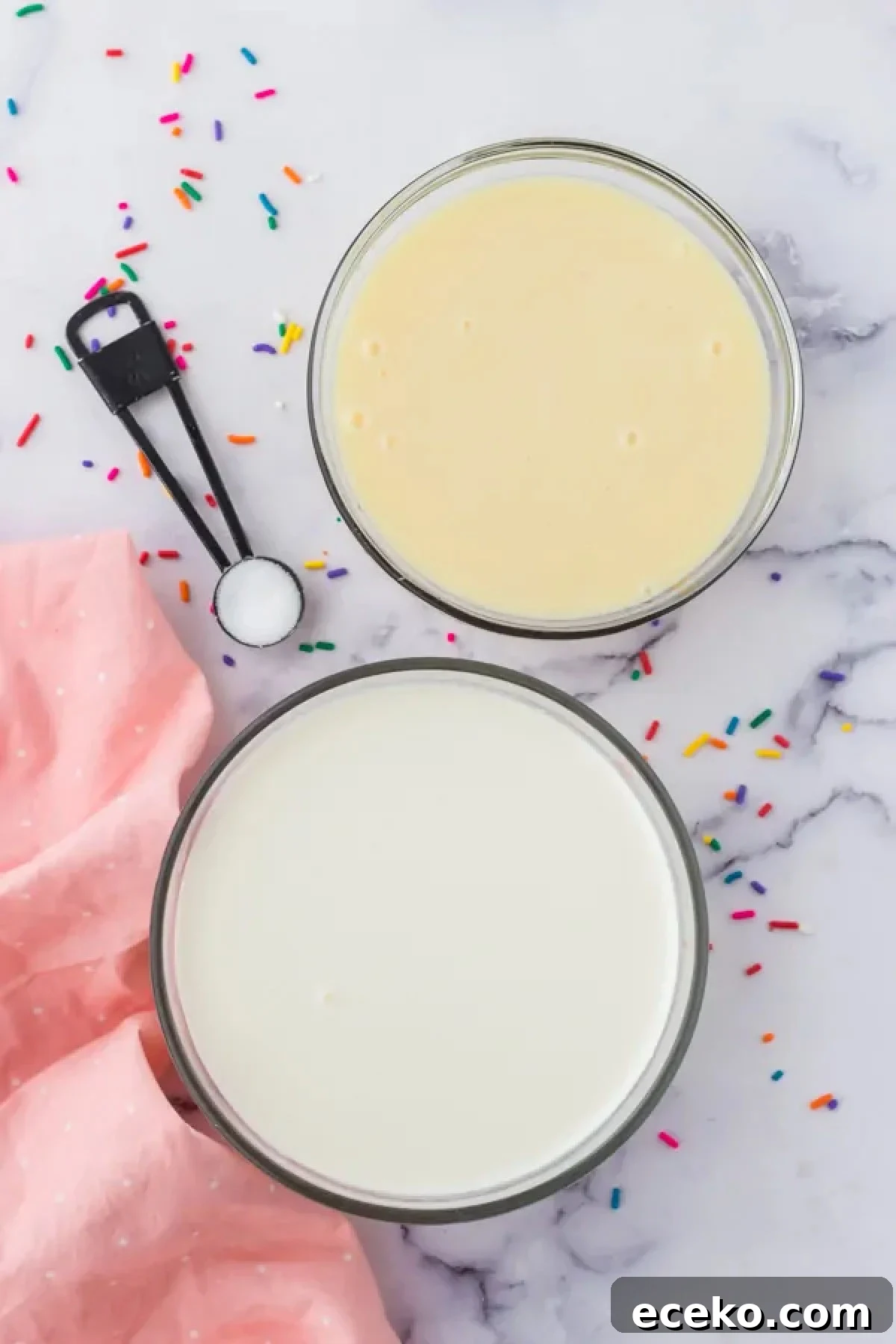 How to Make Rolled Ice Cream at Home: Step-by-Step Recipe 4 Bowl of heavy cream beside a bowl of sweetened condensed milk.