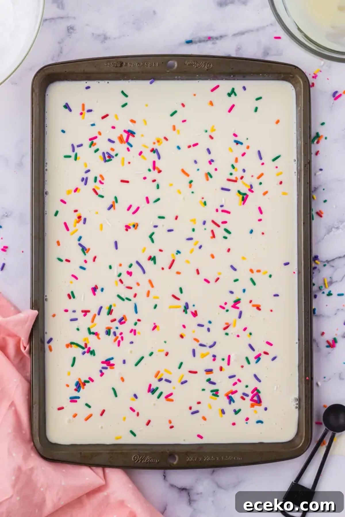 How to Make Rolled Ice Cream at Home: Step-by-Step Recipe 6 Ice cream mixture spread on baking sheet.