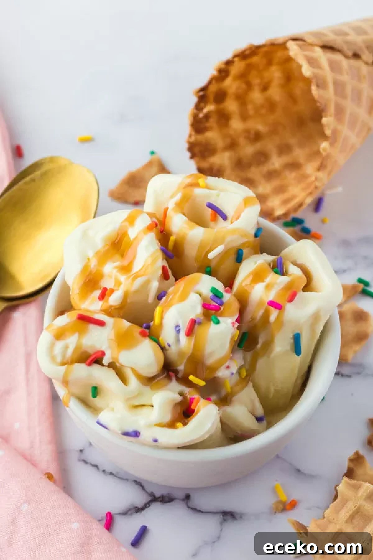 How to Make Rolled Ice Cream at Home: Step-by-Step Recipe 7 Rolled ice cream in bowl topped with caramel sauce.