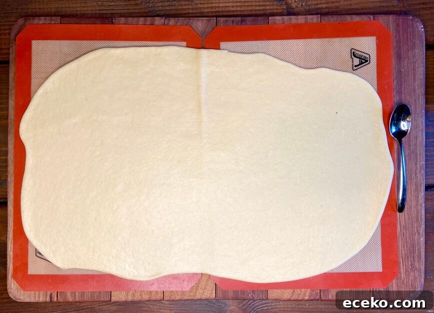 Dough rolled out on silicone mats.