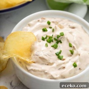 Creamy Homemade French Onion Dip Recipe for Parties 11 Potato chip in a bowl of french onion dip