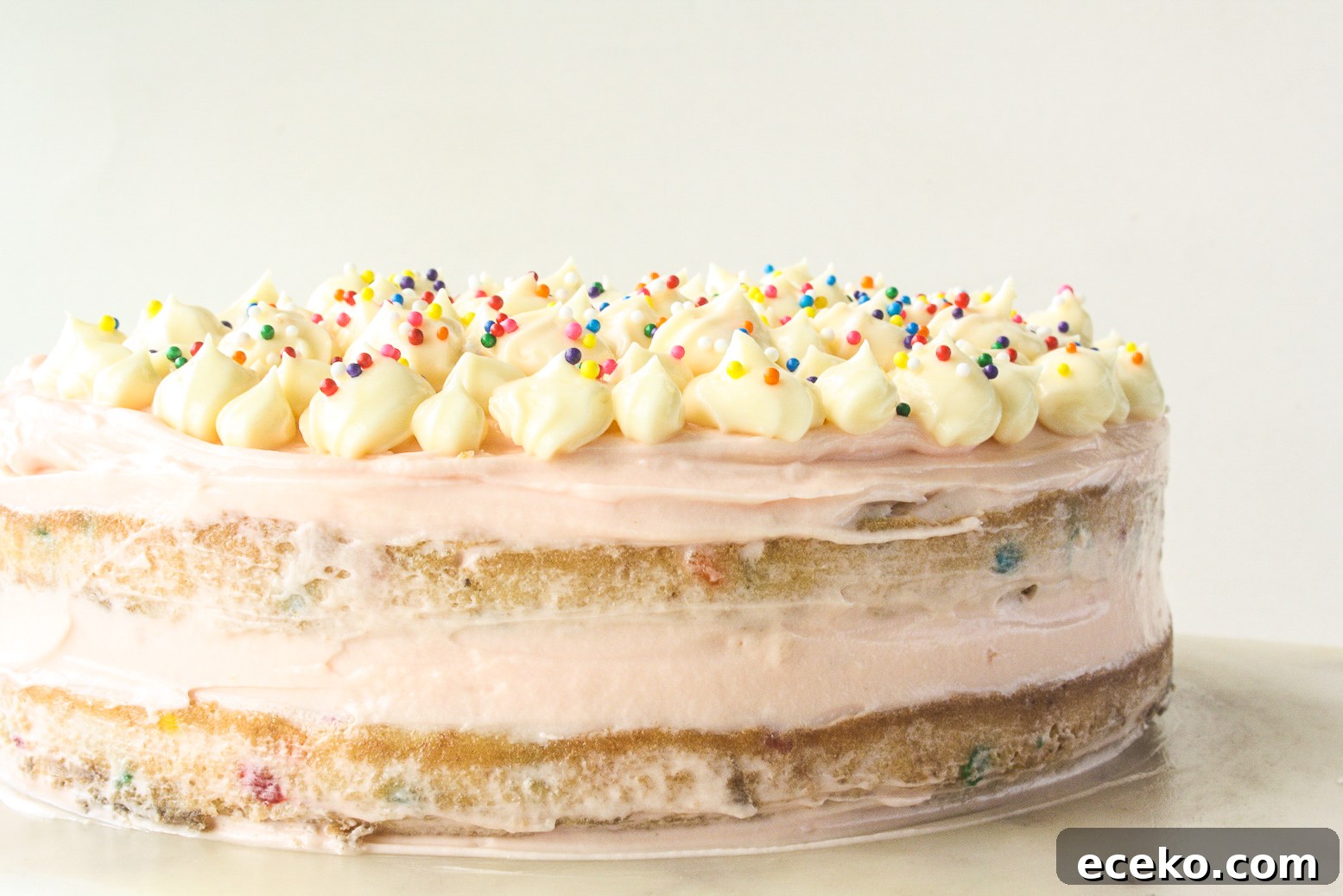 Funfetti Layer Cake with Cream Cheese Frosting Recipe 2 Buttery layer cake with sprinkles and pink frosting!