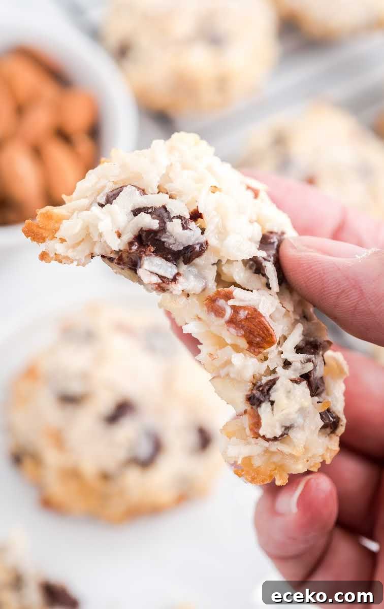 close up shot of Almond Joy Cookies with a bite taken out of it
