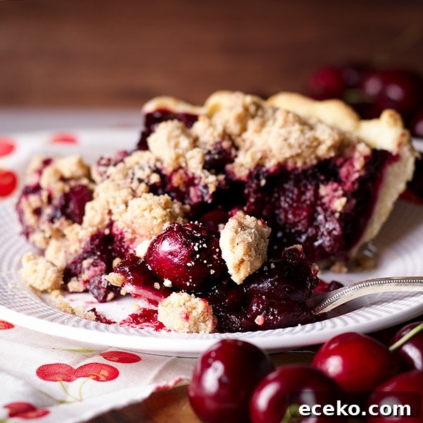 Taking a bite of a slice of Cherry Crumb Pie