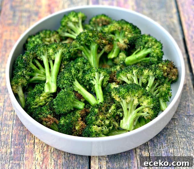 roasted air fryer broccoli in a white bowl