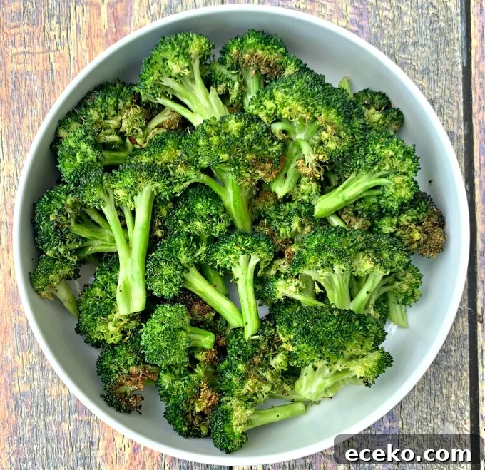 roasted air fryer broccoli in a white bowl