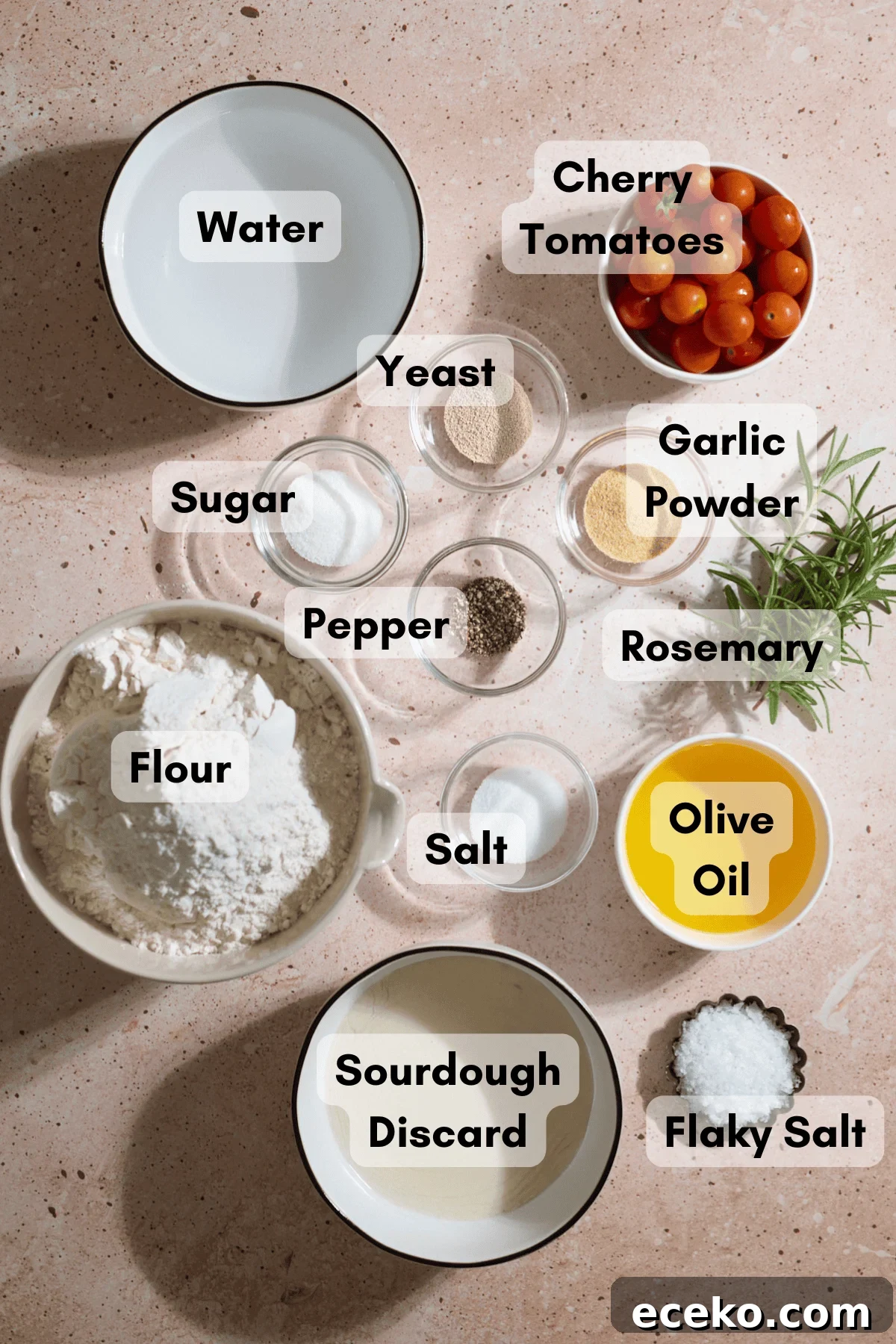 Ingredients for Sourdough Discard Tomato Focaccia in small bowls.