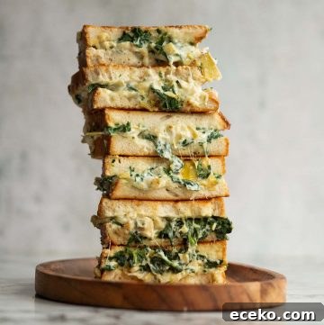 6 sandwich halves stacked on each other with filling dripping out