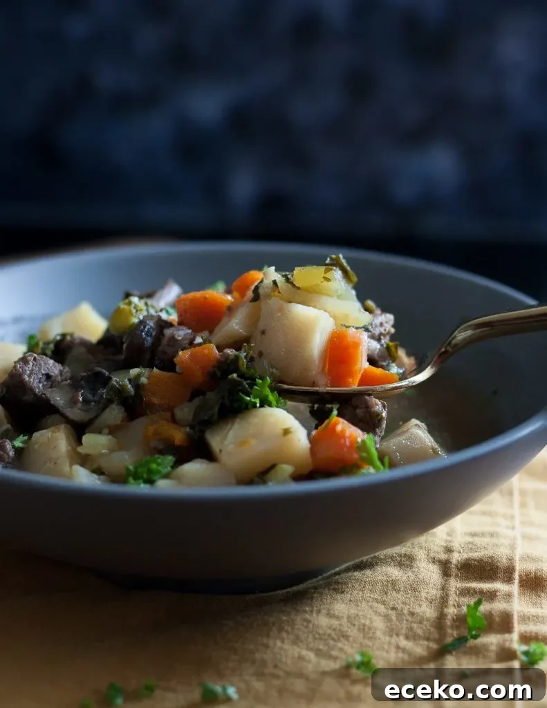 Stay warm when it's cold with nourishing food like this veggie packed winter kale beef soup recipe! * GoodieGodmother.com