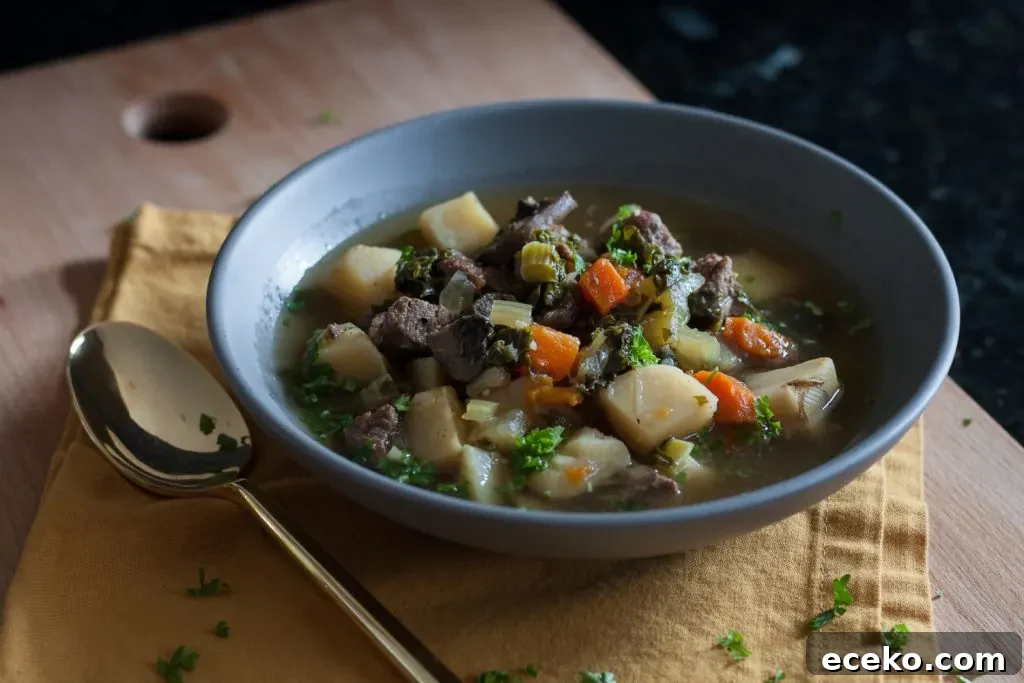 Stay warm when it's cold with nourishing food like this veggie packed winter kale beef soup recipe! * GoodieGodmother.com