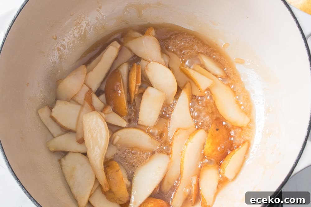Caramelized Pear & Blue Cheese Tartlets for Entertaining 6 pears in skillet with melted butter and brown sugar