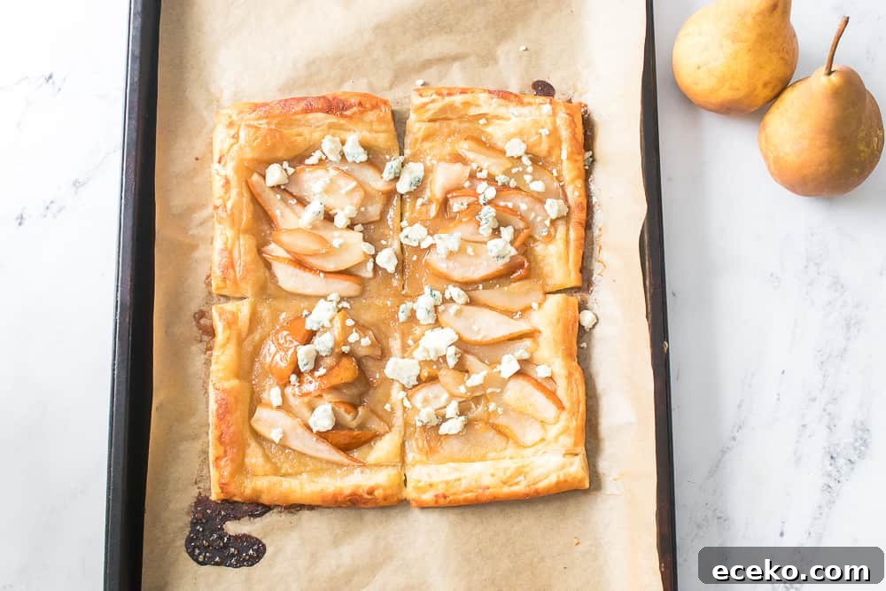 Caramelized Pear & Blue Cheese Tartlets for Entertaining 10 overhead shot of baked puff pastry with caramelized pears, blue cheese and toasted walnuts