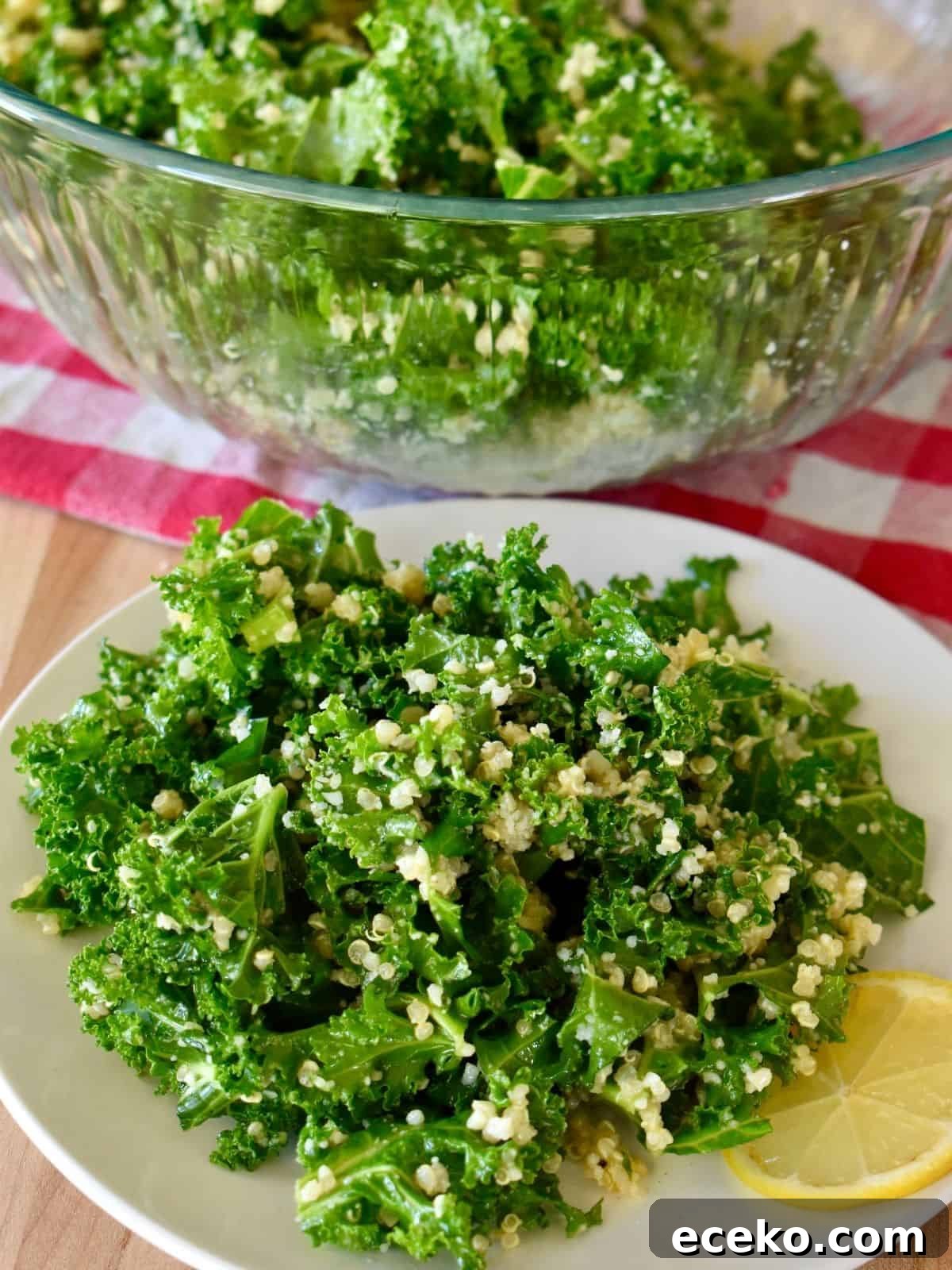 Kale Quinoa salad with lemon vinaigrette on a white plate.