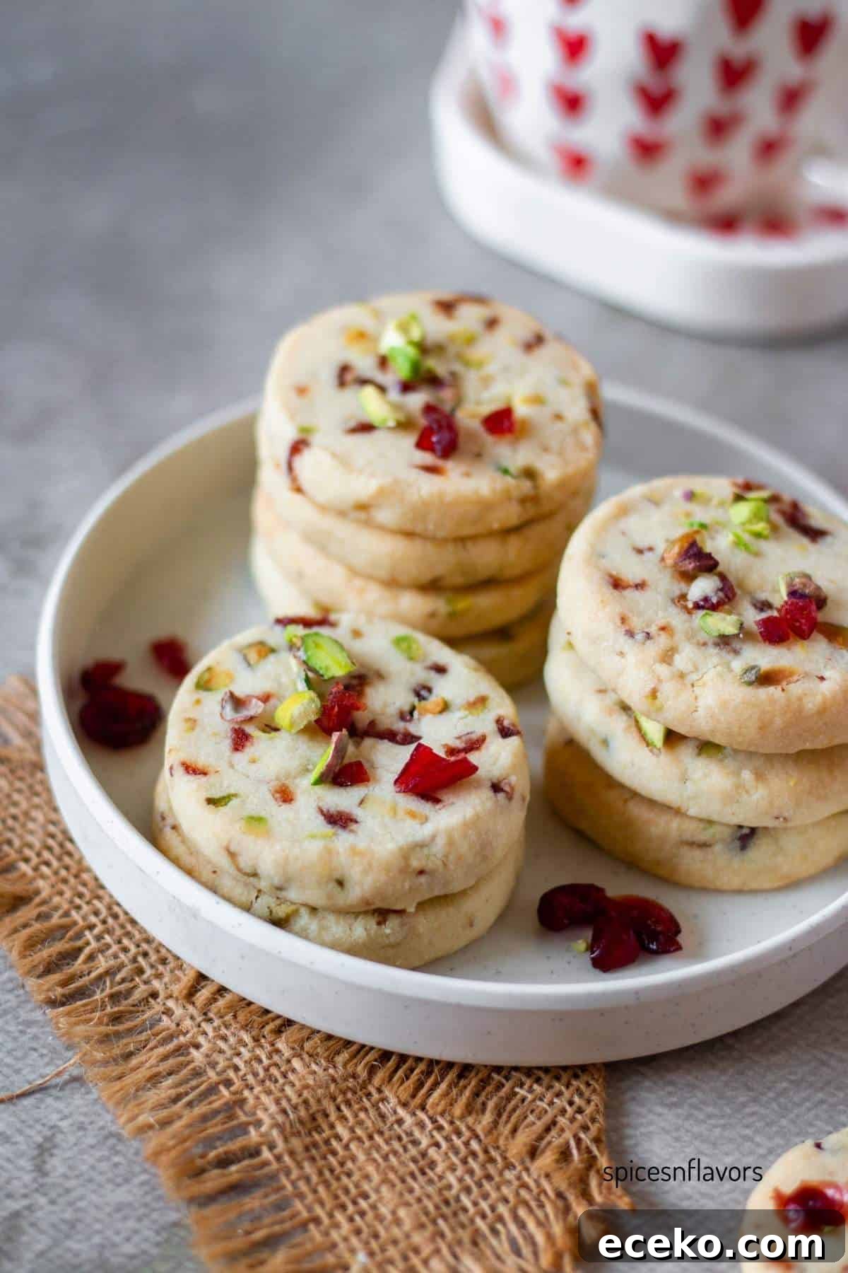 cranberry pistachio cookies placed on a white plate