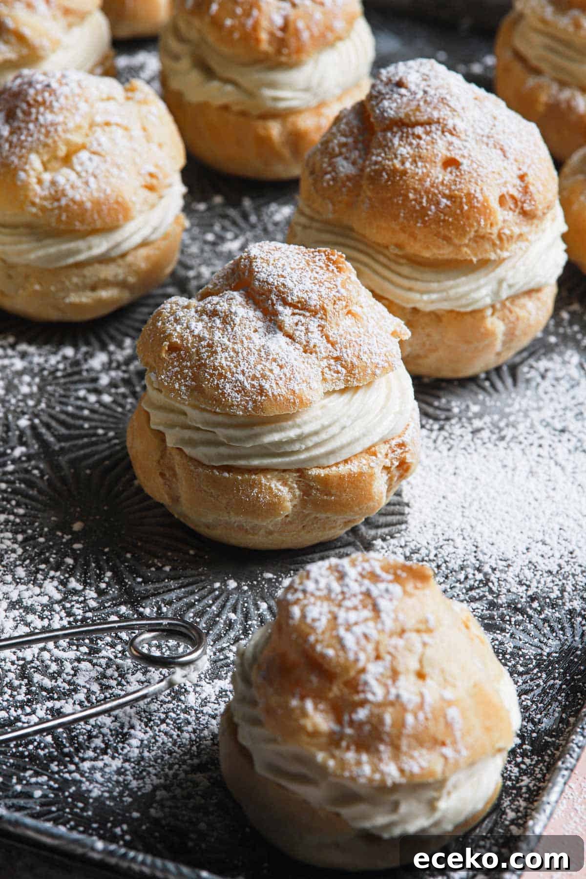 filled cream puffs in a tray.