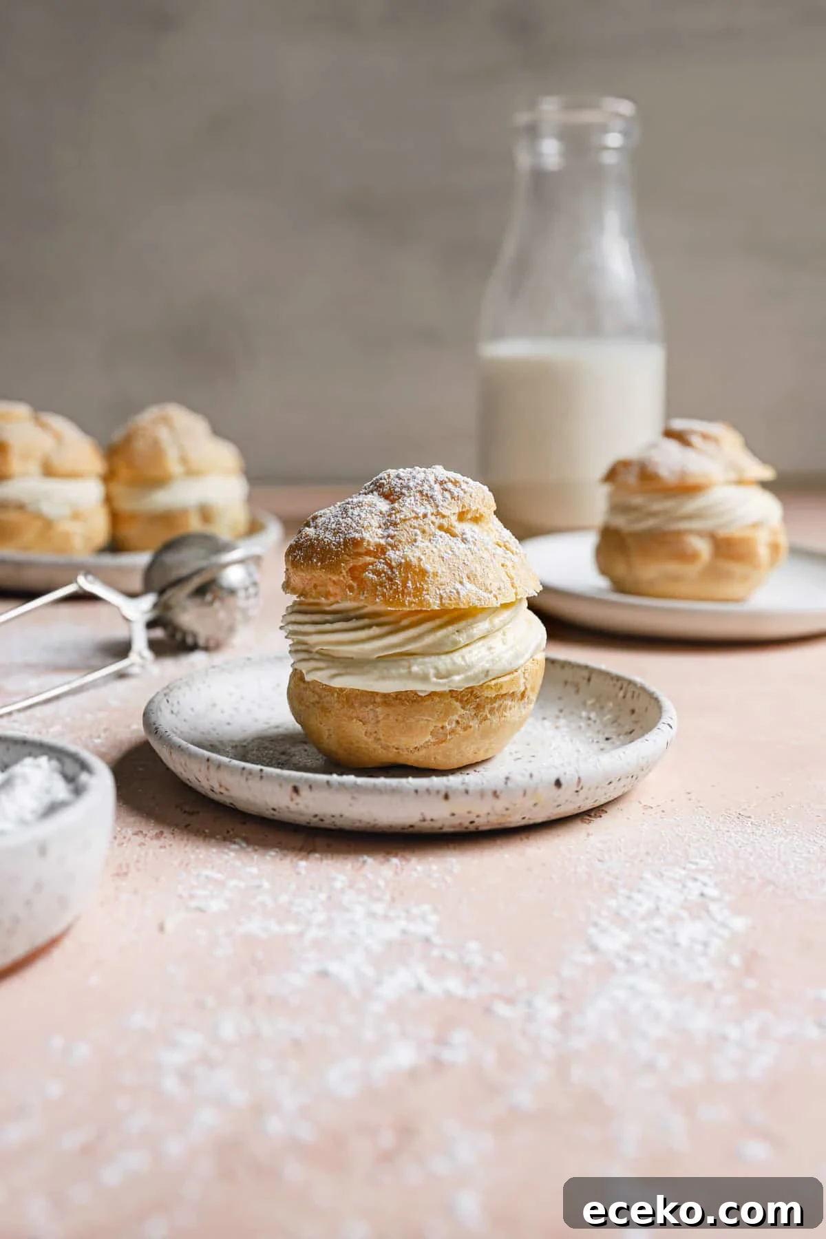 filled choux pastries on plates.