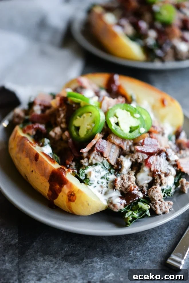 BBQ Bacon Burger Stuffed Meal-Prep Potatoes 2 meal prep bbq bacon burger loaded potatoes on a plate topped with jalapenos