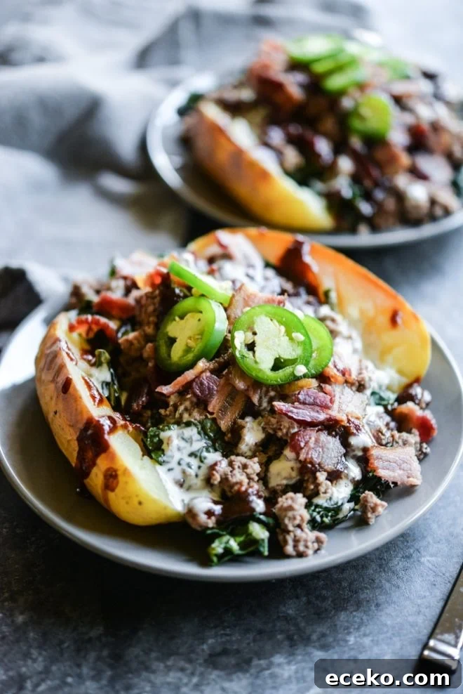 BBQ Bacon Burger Stuffed Meal-Prep Potatoes 5 meal prep bbq bacon burger loaded potatoes on a plate topped with jalapenos