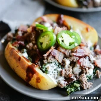 BBQ Bacon Burger Stuffed Meal-Prep Potatoes 6 meal prep bbq bacon burger loaded potatoes on a plate topped with jalapenos