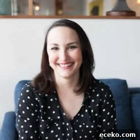 BBQ Bacon Burger Stuffed Meal-Prep Potatoes 8 smiling woman in a black and white polka dot shirt with short dark hair sitting in a blue chair