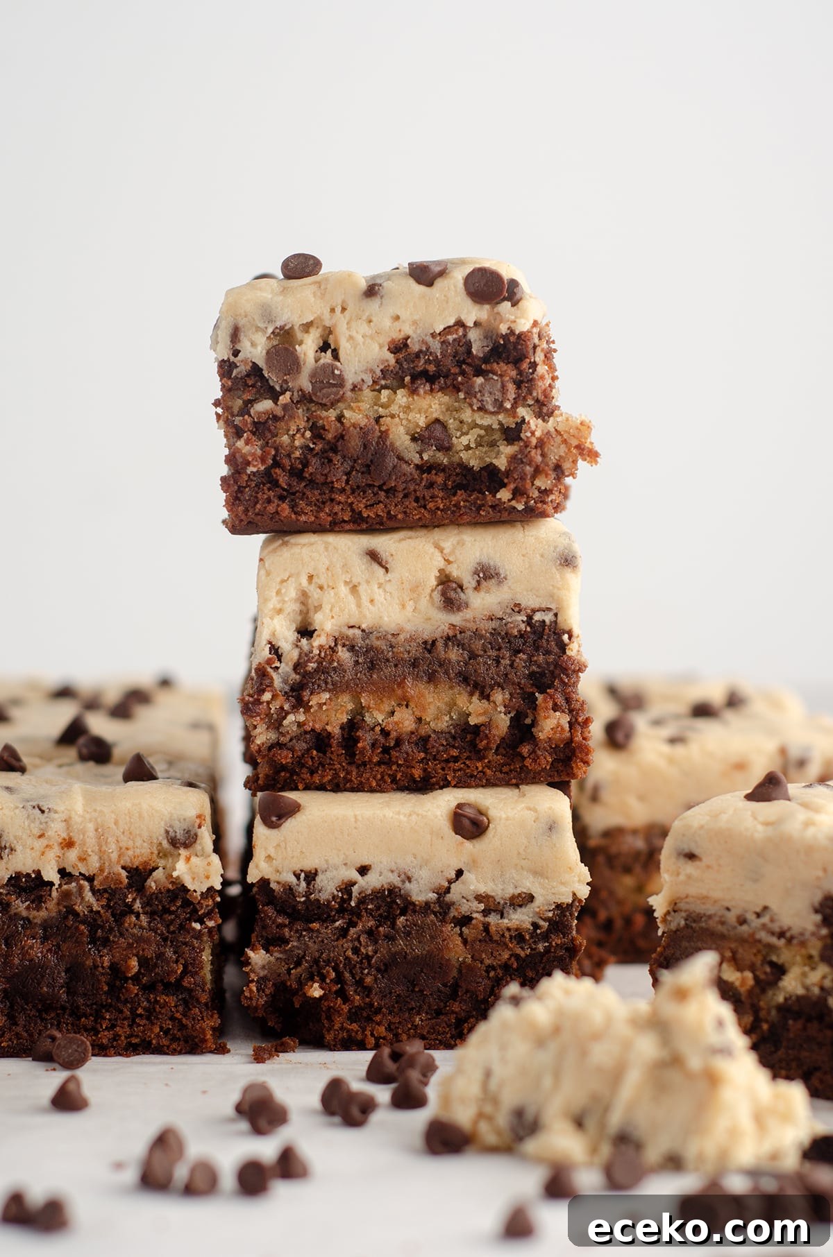 Cookie Dough Stuffed Brownies: Decadent Chocolate Dessert Recipe 3 stack of 3 cookie dough brownies with cookie dough buttercream