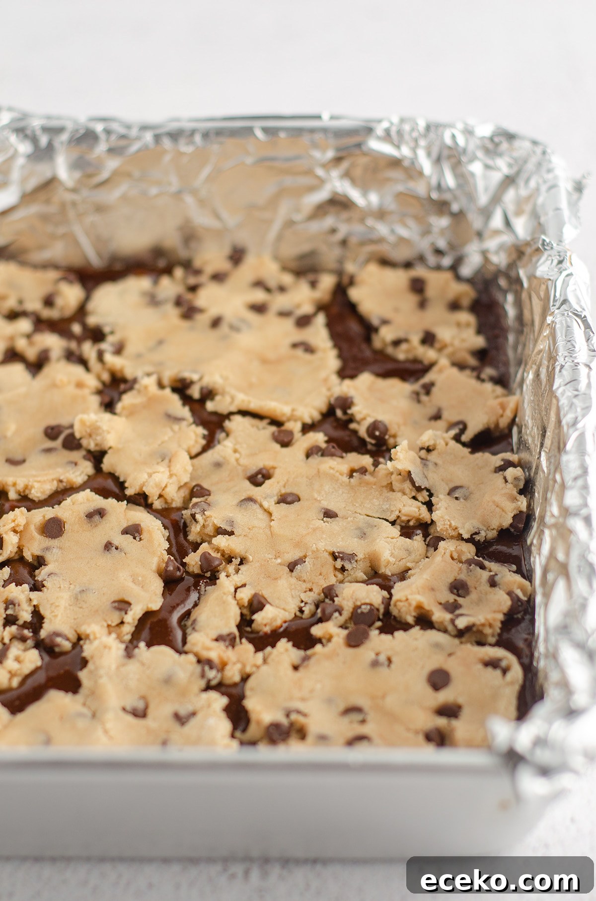 Cookie Dough Stuffed Brownies: Decadent Chocolate Dessert Recipe 7 cookie dough layered onto brownie batter