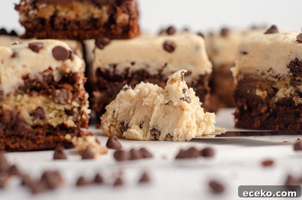 Cookie Dough Stuffed Brownies: Decadent Chocolate Dessert Recipe 10 spatula with a dollop of cookie dough buttercream on it