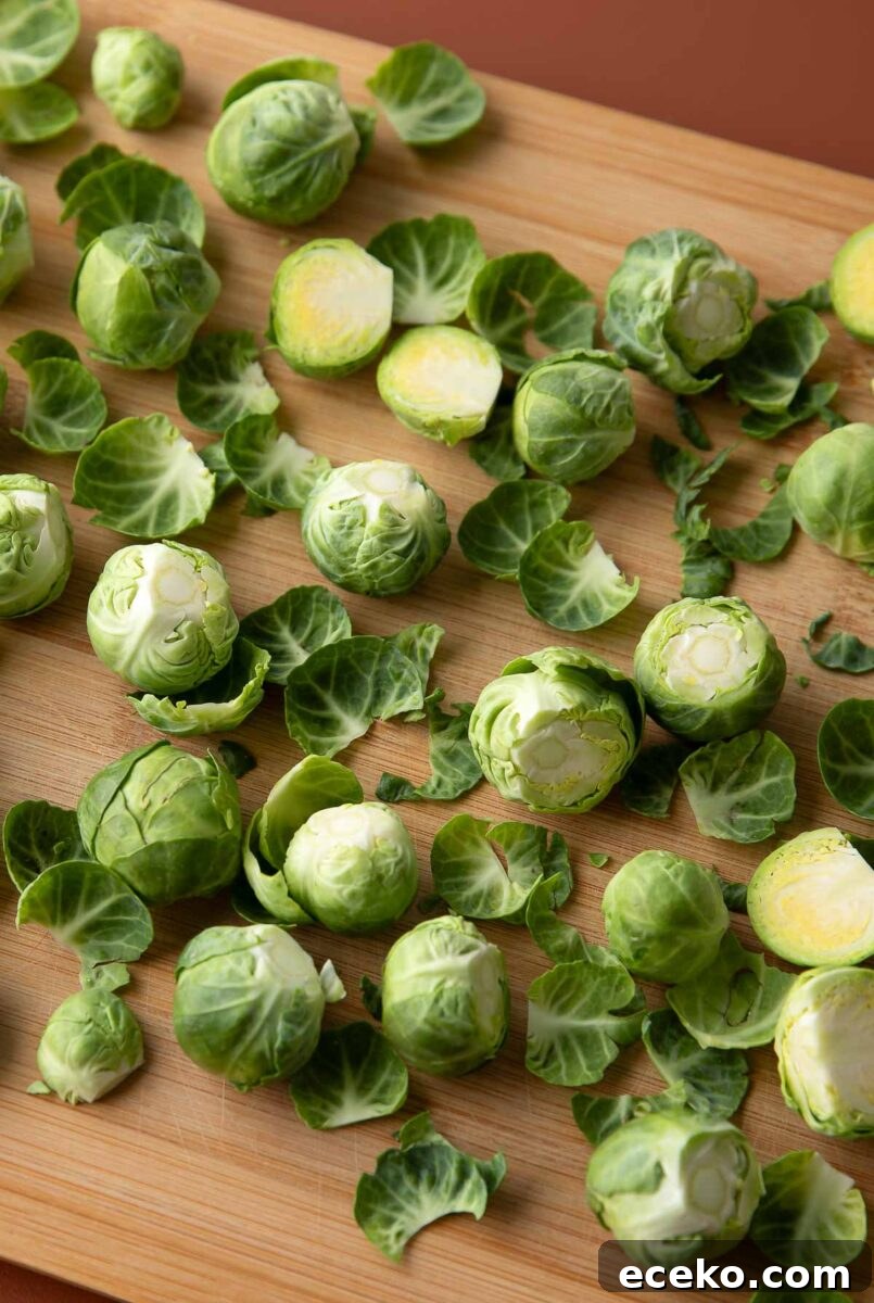 trimmed brussels sprouts on wooden cutting board