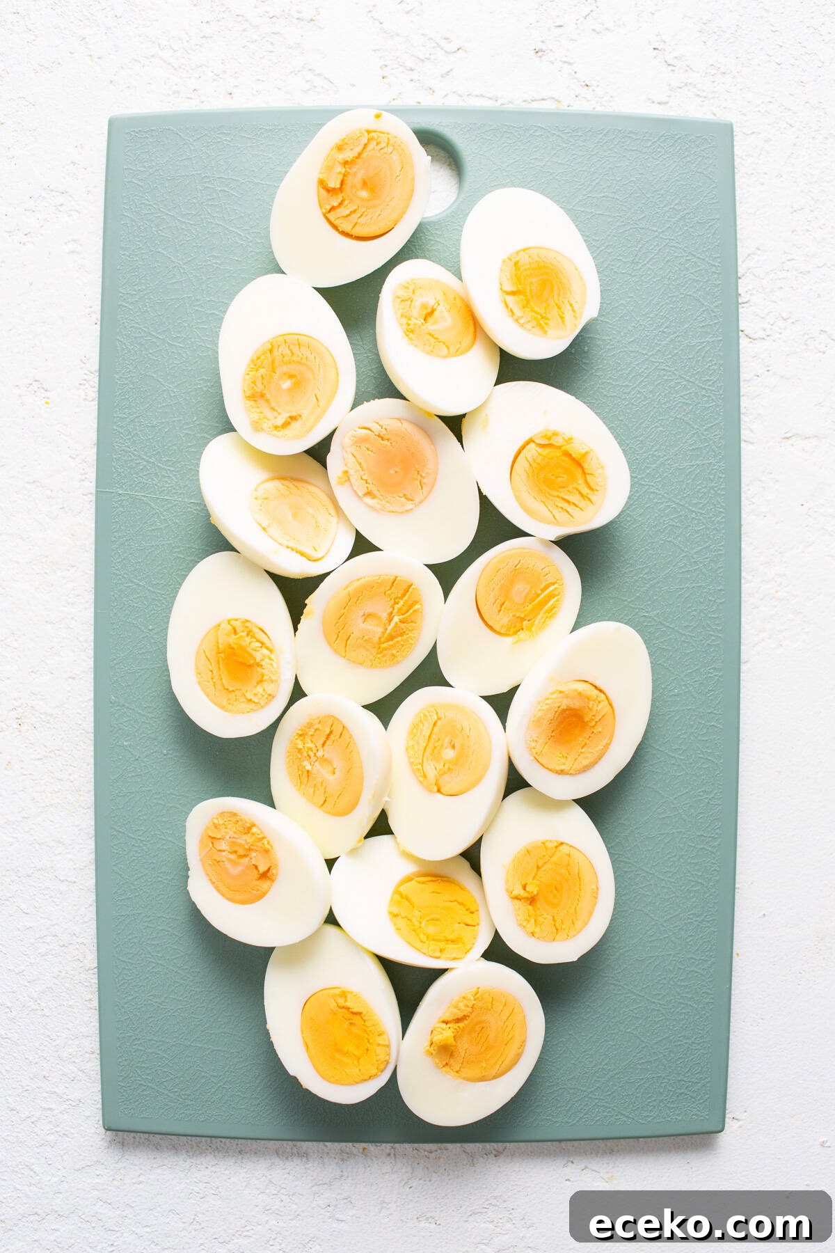 Hard boiled eggs on a cutting board.