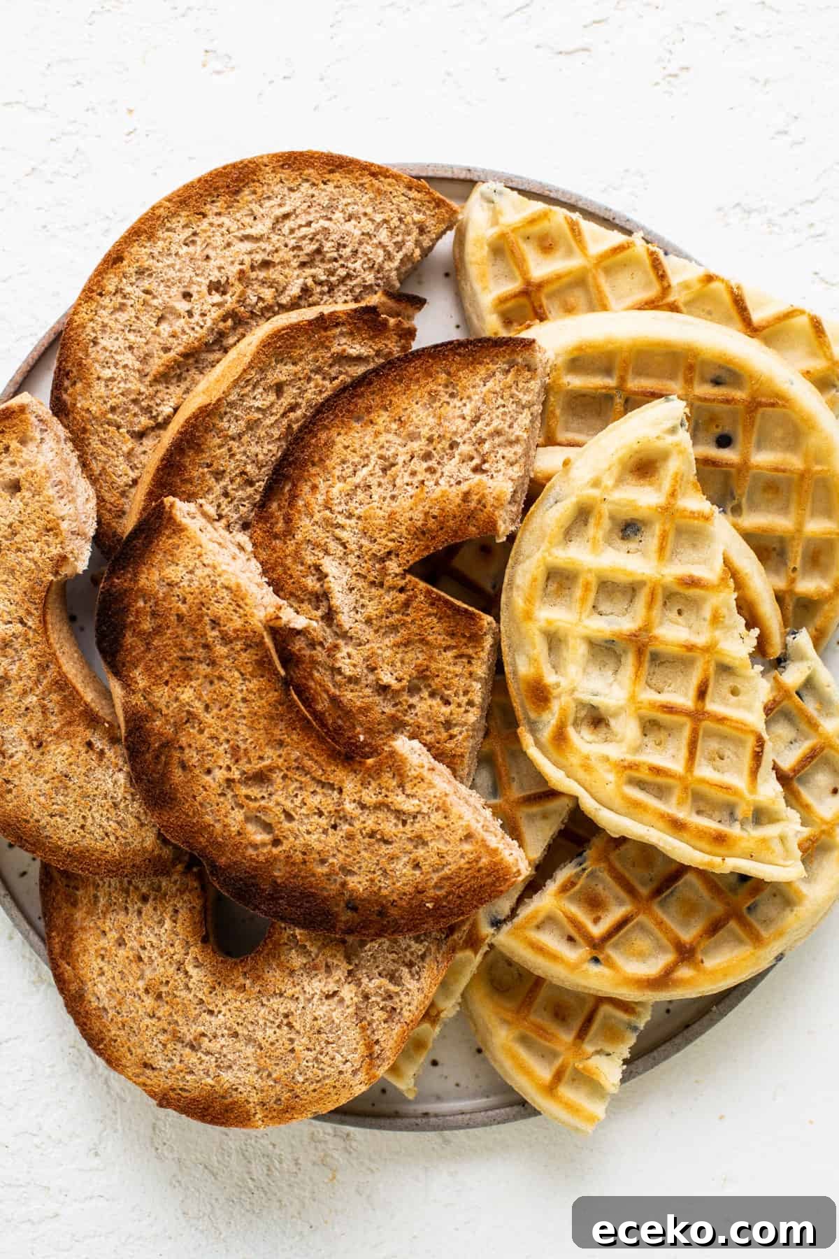 Waffles on a plate on a white background.