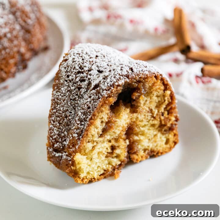 A slice of coffee cake on a white plate.