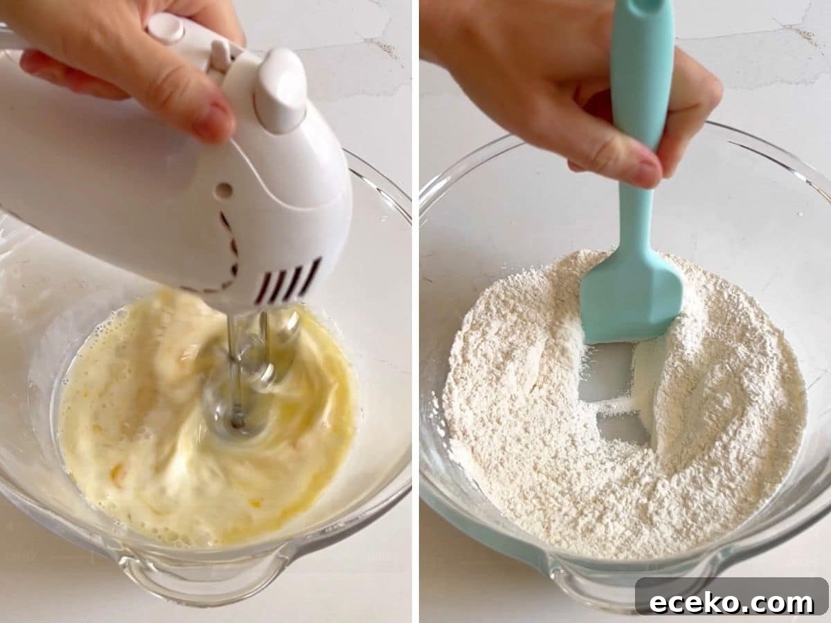 Strawberry Shortcake Crumb Cake Recipe — Moist Summer Dessert 5 Wet ingredients being mixed together with a hand mixer and dry ingredients in a glass bowl withe spatula making a hole in the middle.