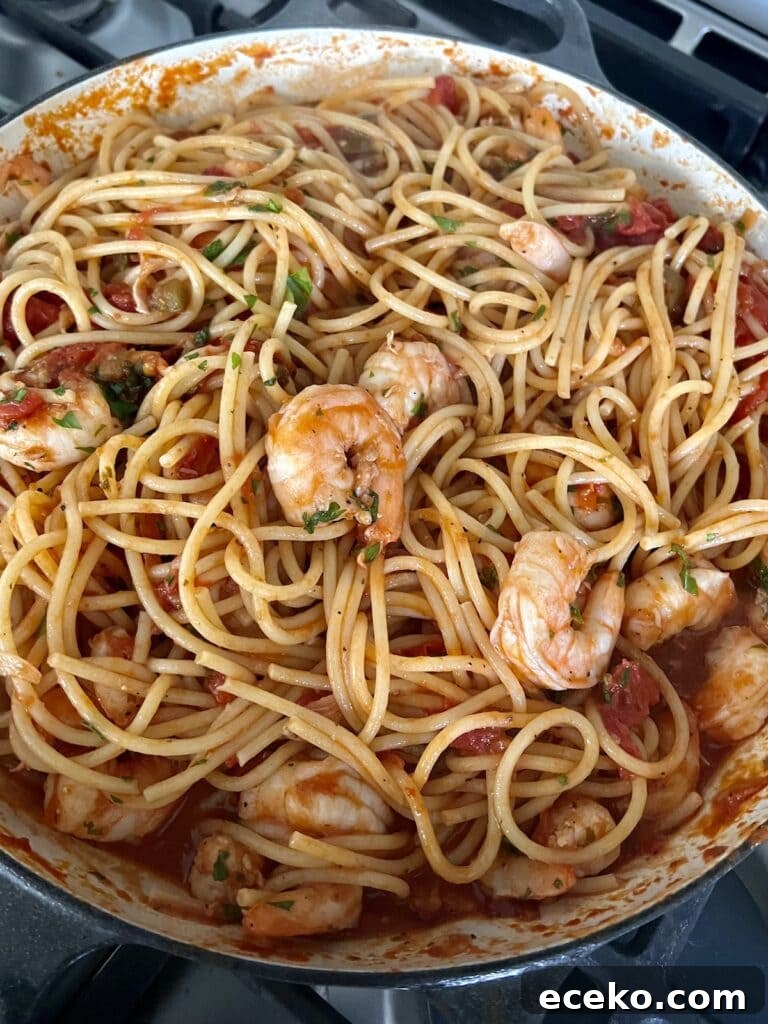 Spicy Shrimp Arrabbiata Pasta with Garlic Tomato Sauce 9 Finished shrimp arrabbiata pasta in skillet.