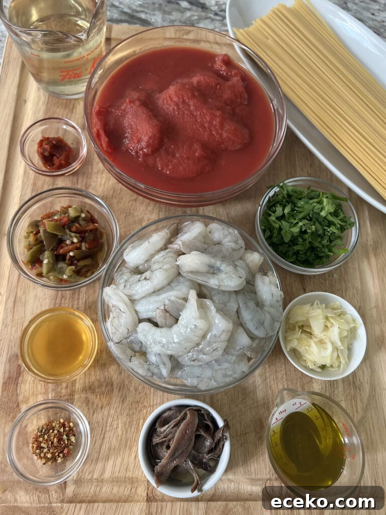 Spicy Shrimp Arrabbiata Pasta with Garlic Tomato Sauce 4 All spicy shrimp arrabbiata pasta recipe ingredients on cutting board.