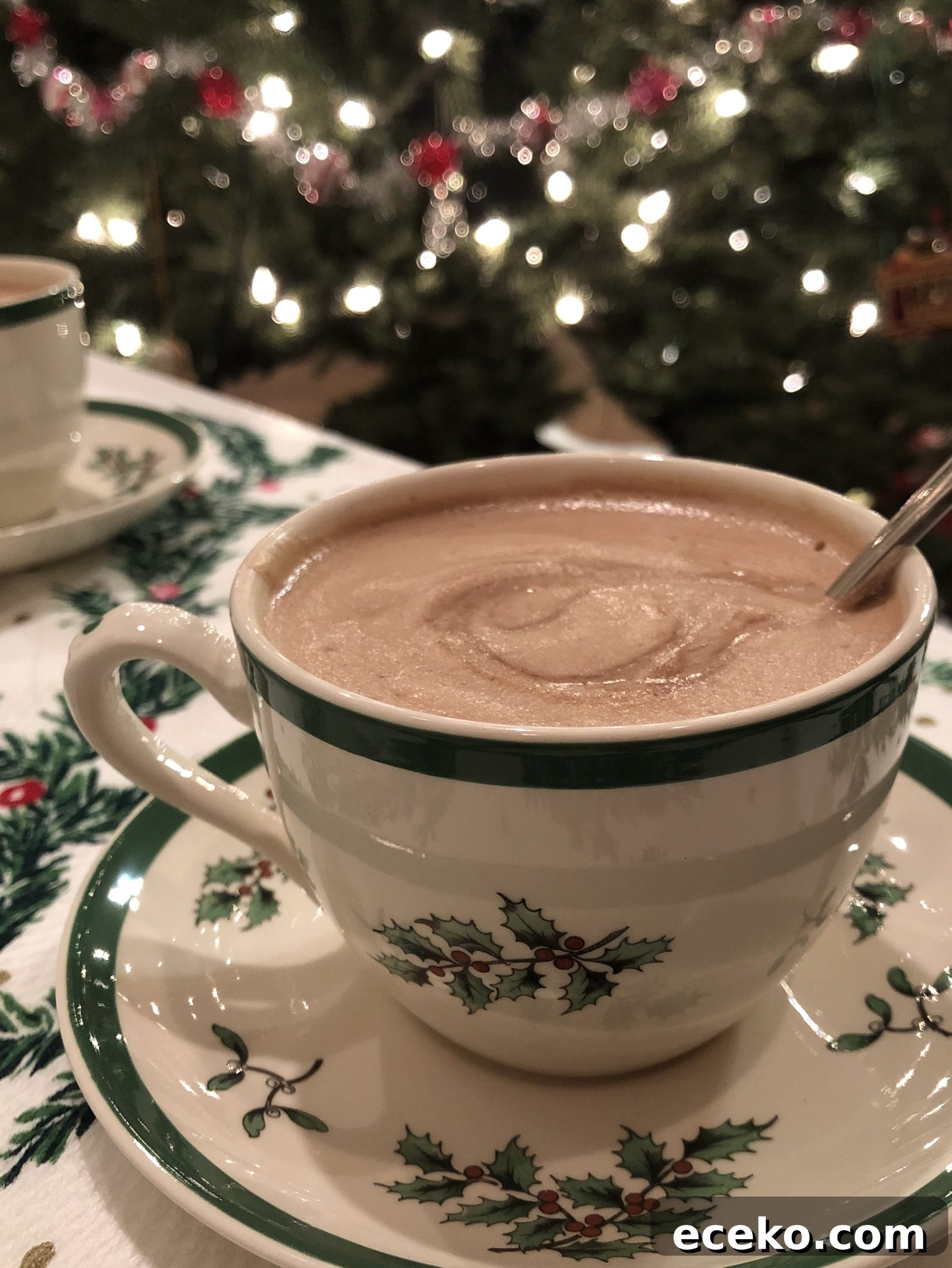 Authentic French Hot Chocolate Recipe — Rich, Velvety Cocoa 7 French Hot Chocolate in a Christmas cup by a Christmas tree