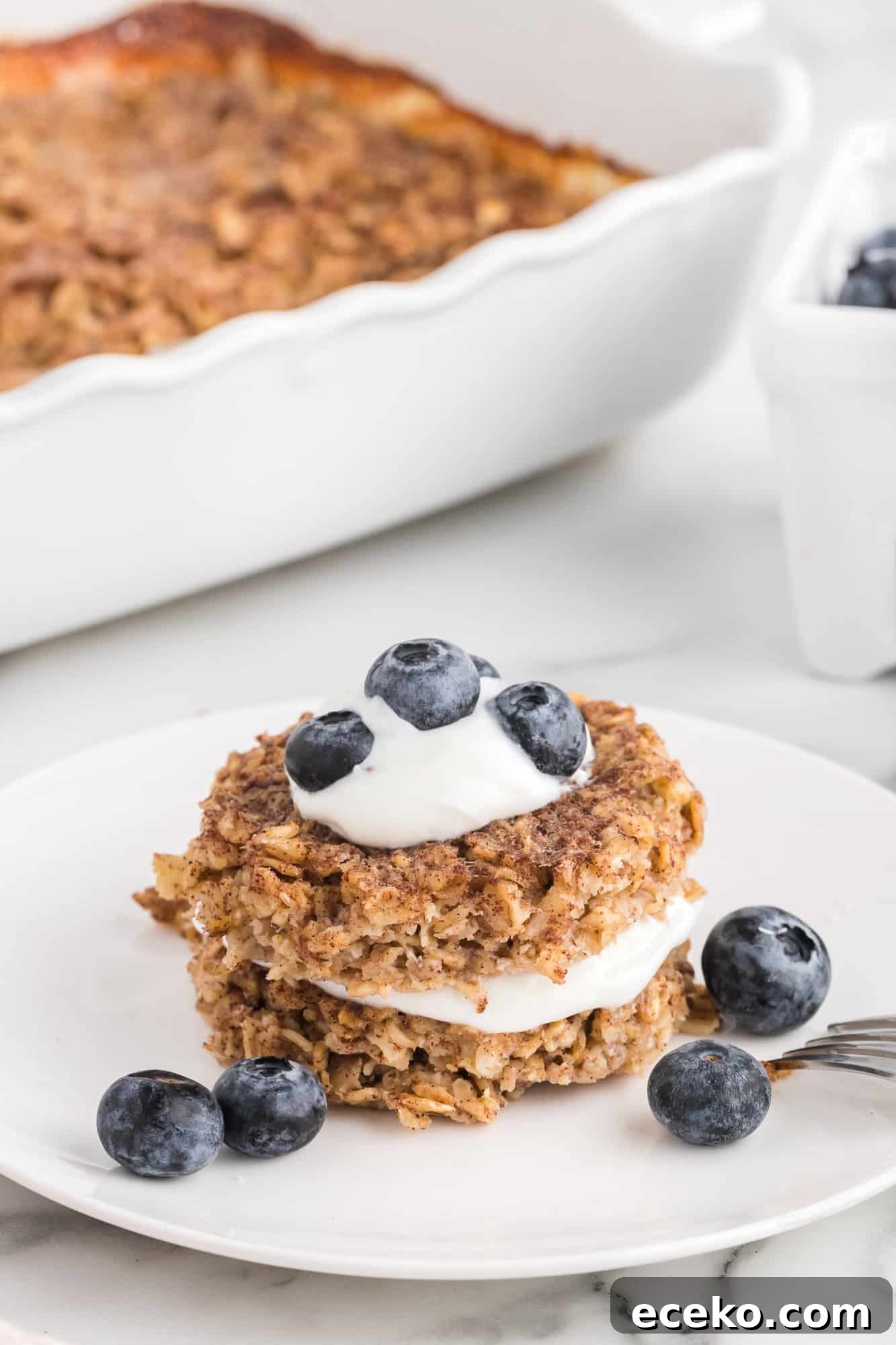 Baked Oatmeal Recipe with Flavor Ideas and Variations 9 Baked oatmeal layered with yogurt and blueberries.