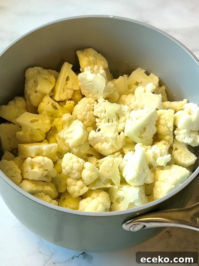 Roasted Cauliflower and Potato Salad with Herb Vinaigrette 3 Cauliflower florets in a saucepan with water to steam.