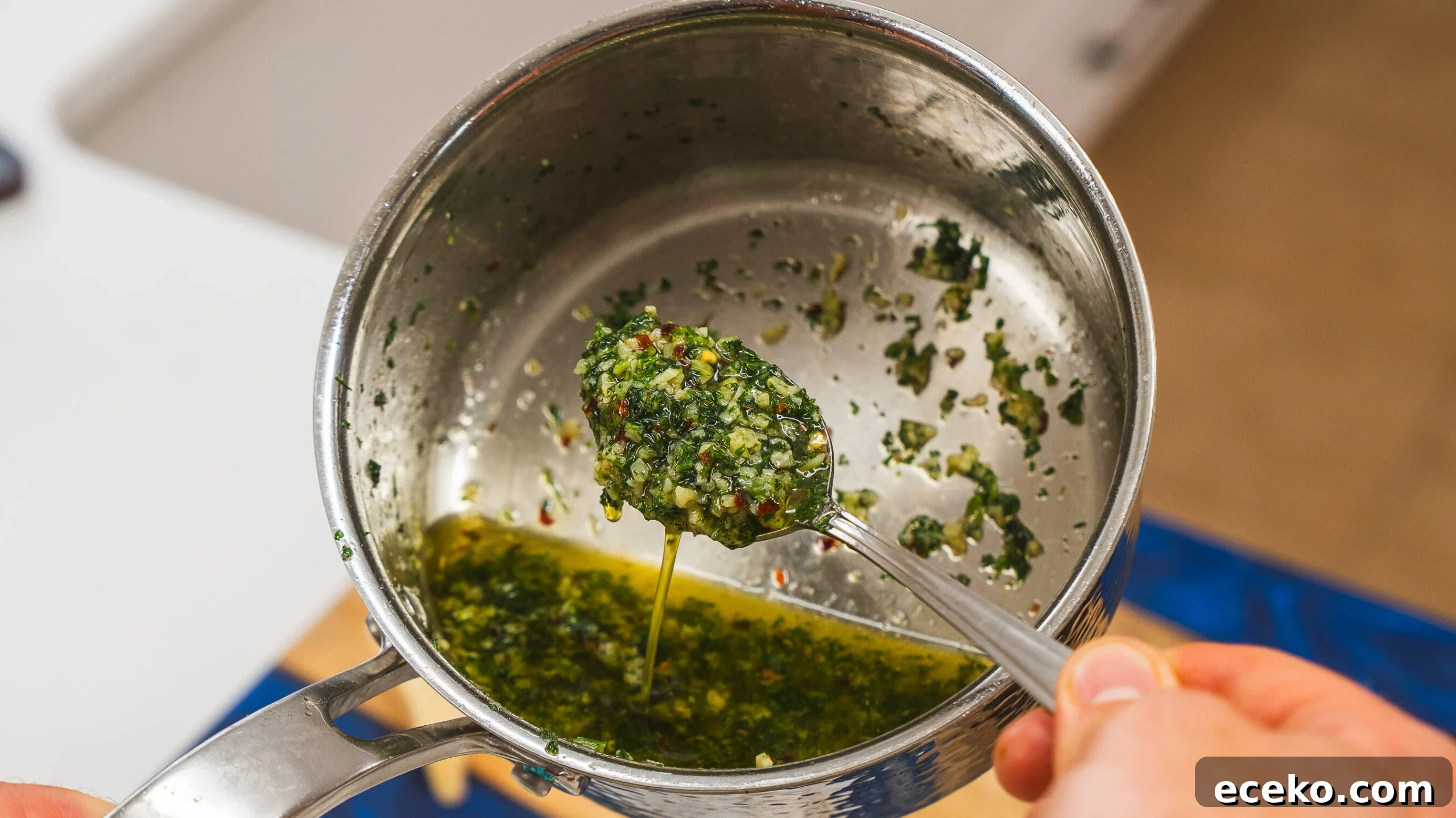 A stainless steel pot of garlic butter for your garlic butter steak bites.