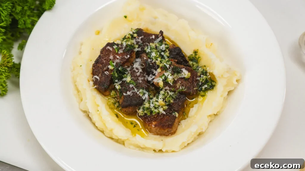 Garlic butter steak bites over mashed potatoes.