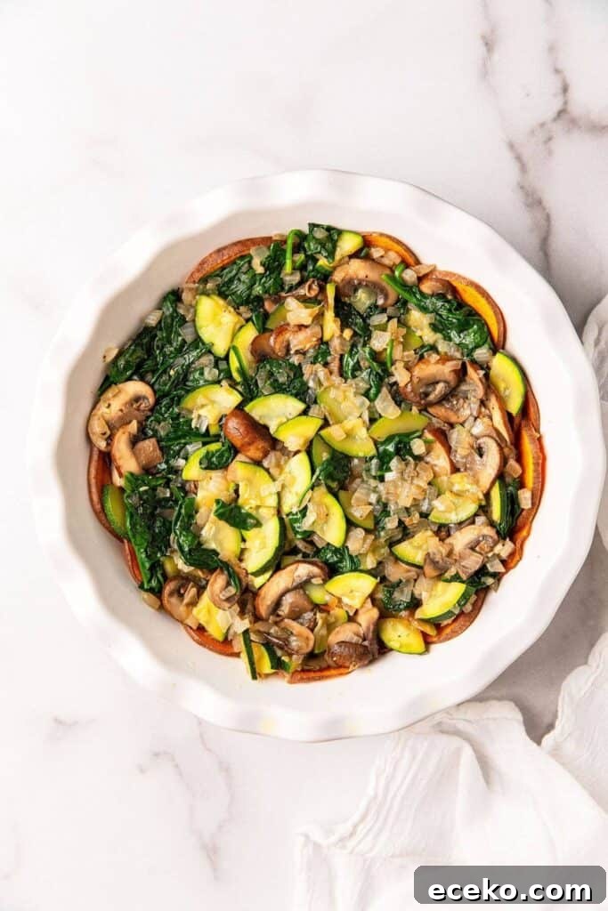 Gluten-Free Feta and Spinach Quiche Recipe 7 sauted mushrooms, onions, zucchini and spinach in pie pan